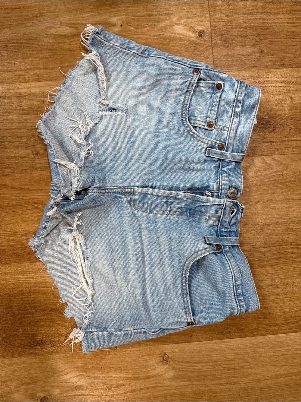 Levi's Light Blue Denim Jeans with Tan Stitching and Pinkish Label